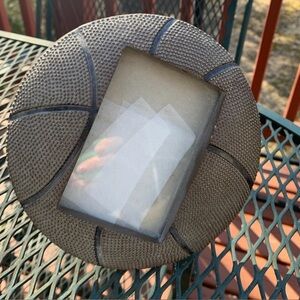 Basketball Raised patterned basketball shaped picture frame .